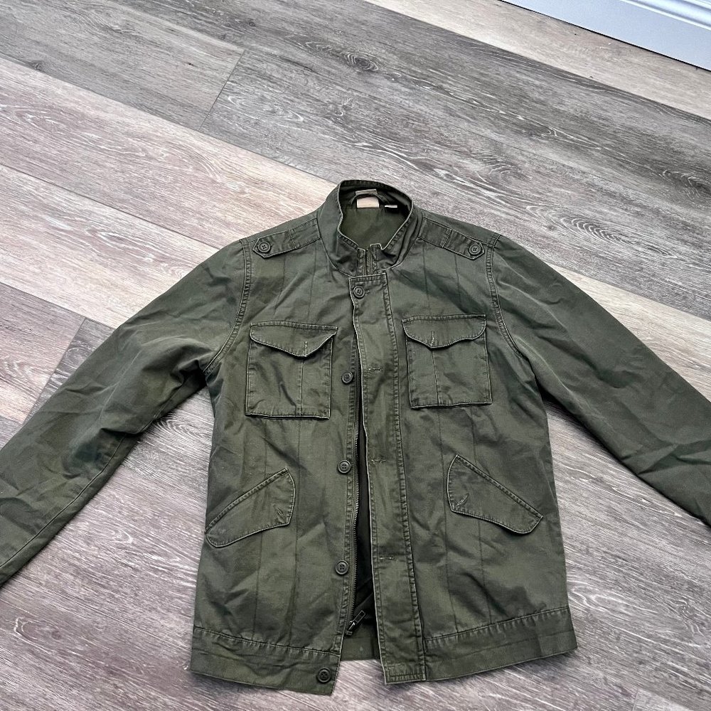 light green jacket , many pockets